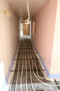 Link corridor showing underfloor heating pipes